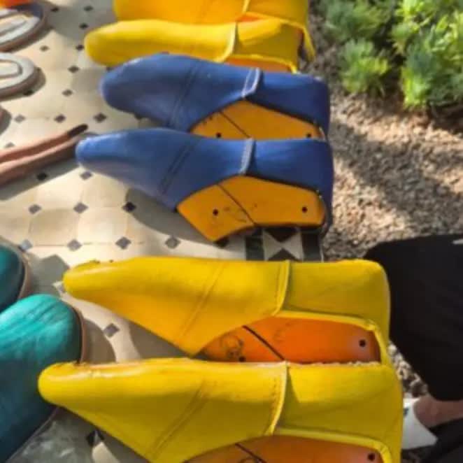 Rows of wooden shoe lasts in the leather atelier