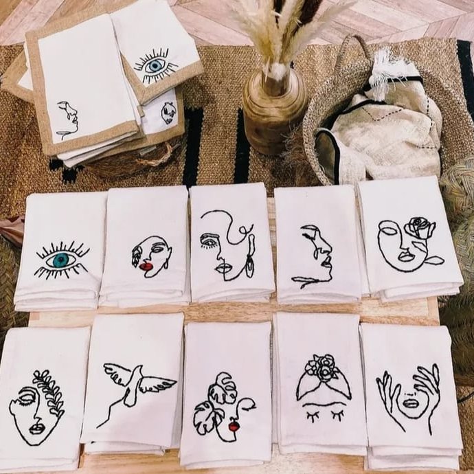 Embroidered napkins with line-art designs