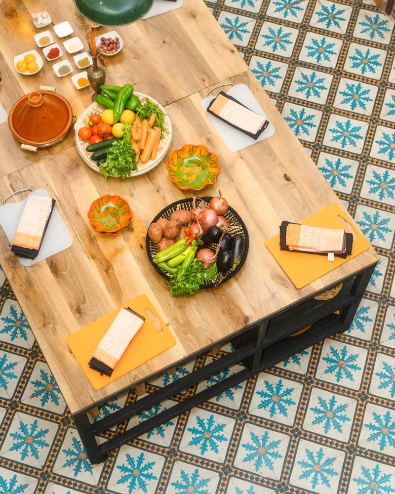 Moroccan ingredients and table prepared for the cooking workshop