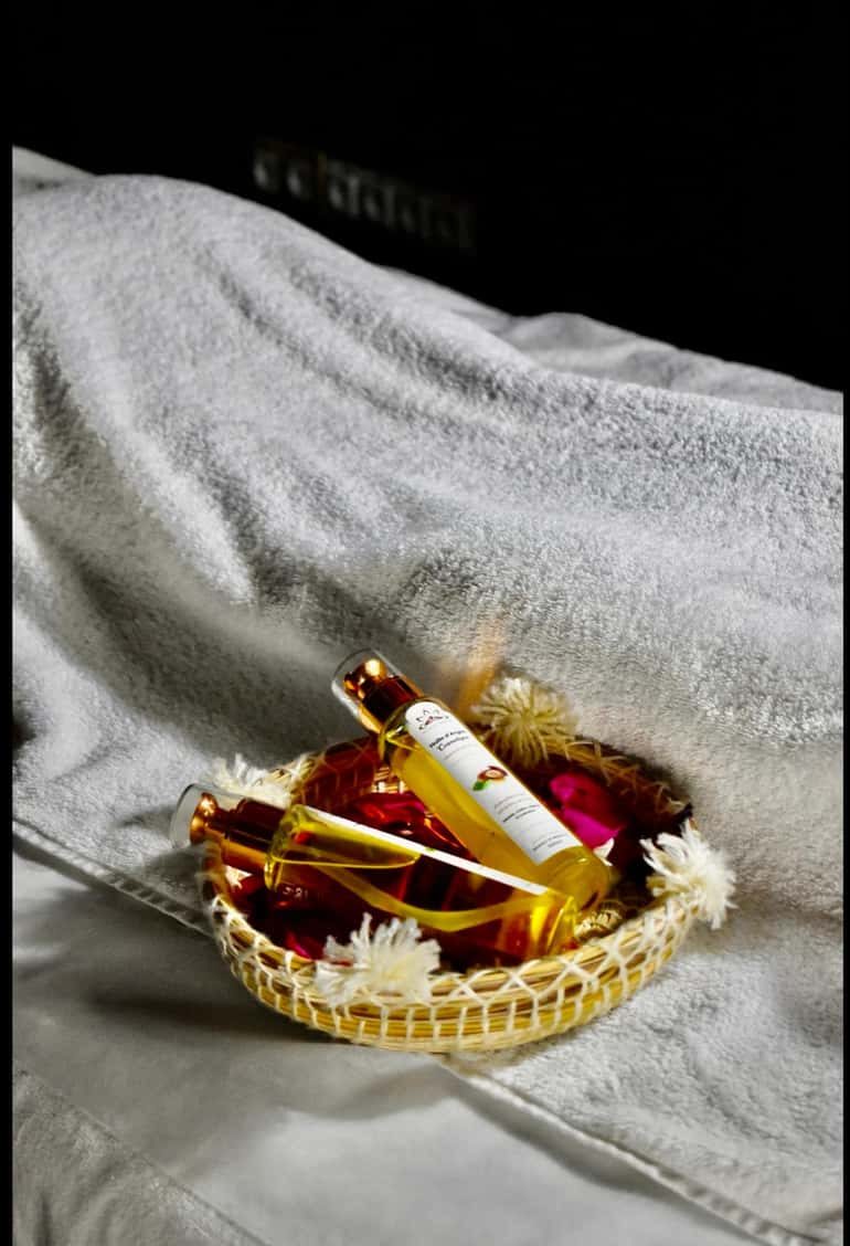 Argan oils in a woven basket ready for the massage